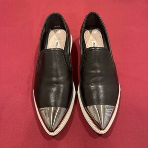 Miu Miu Black Slip-Ons with Silver Accents